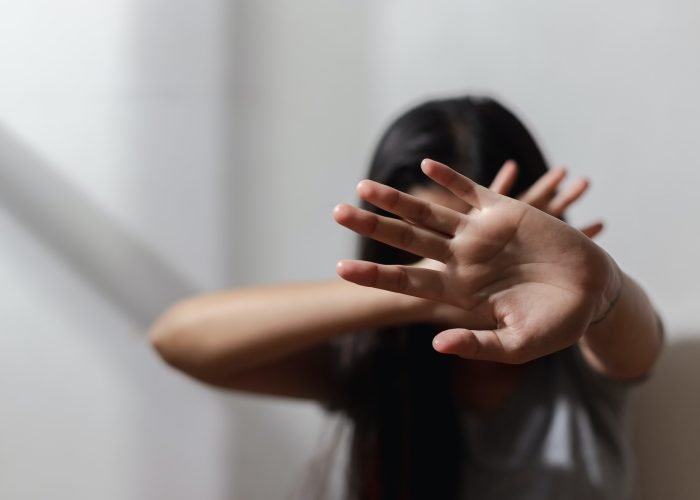 Close up focus of hand woman showing to stop violence fear abuse. domestic pain,