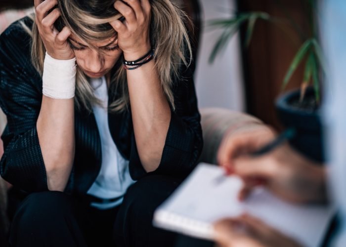 Psychology Concept. Psychotherapist Taking Notes During Session