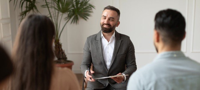 Man with beard doing a counsel to couples(1) Man with beard doing a counsel to couples(1)
